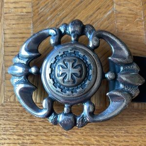 Celtic style belt buckle with black leather belt.